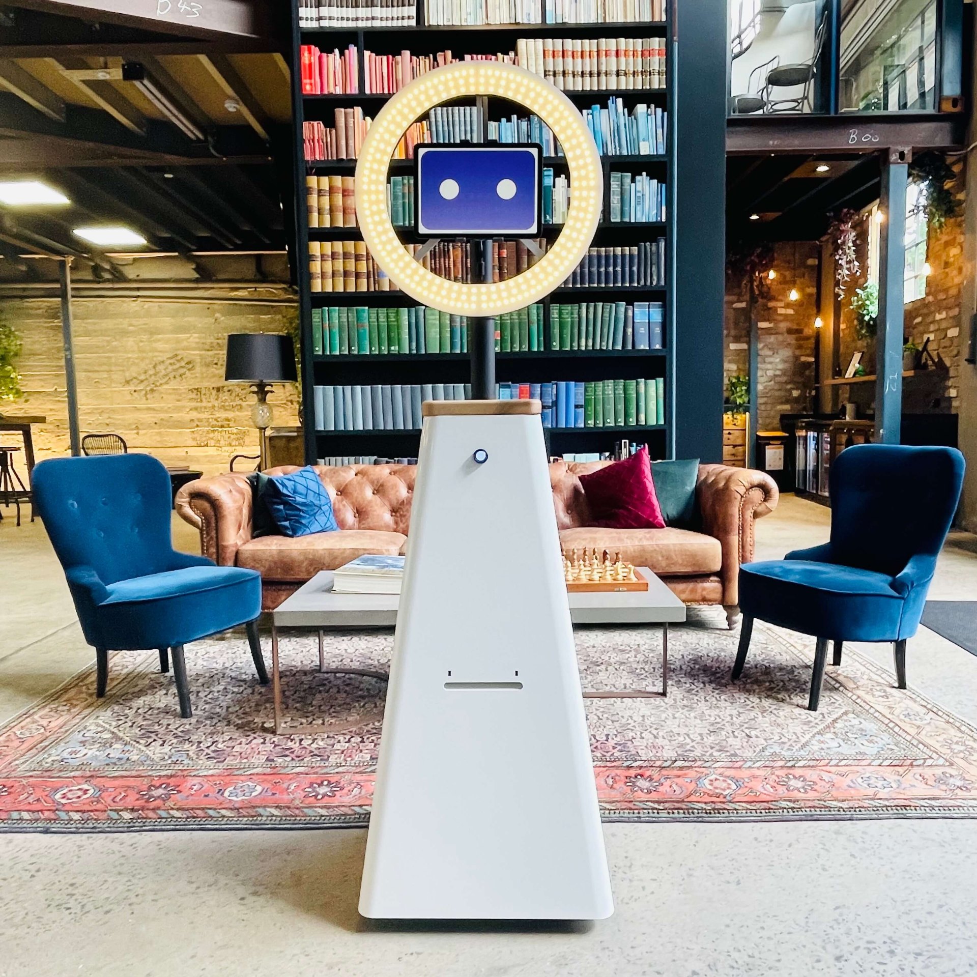 The Social Rover photo robot with its ring light in an event lounge